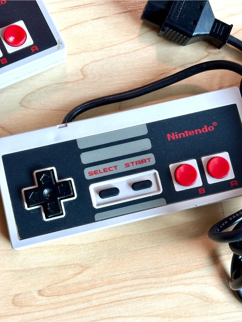 Nintendo Entertainment System (NES) controller, model NES-004. Set of two.